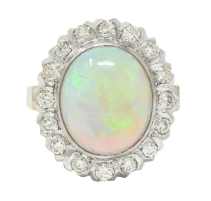 1940's Opal Diamond 14 Karat Two-Tone Gold Vintage Halo Ring