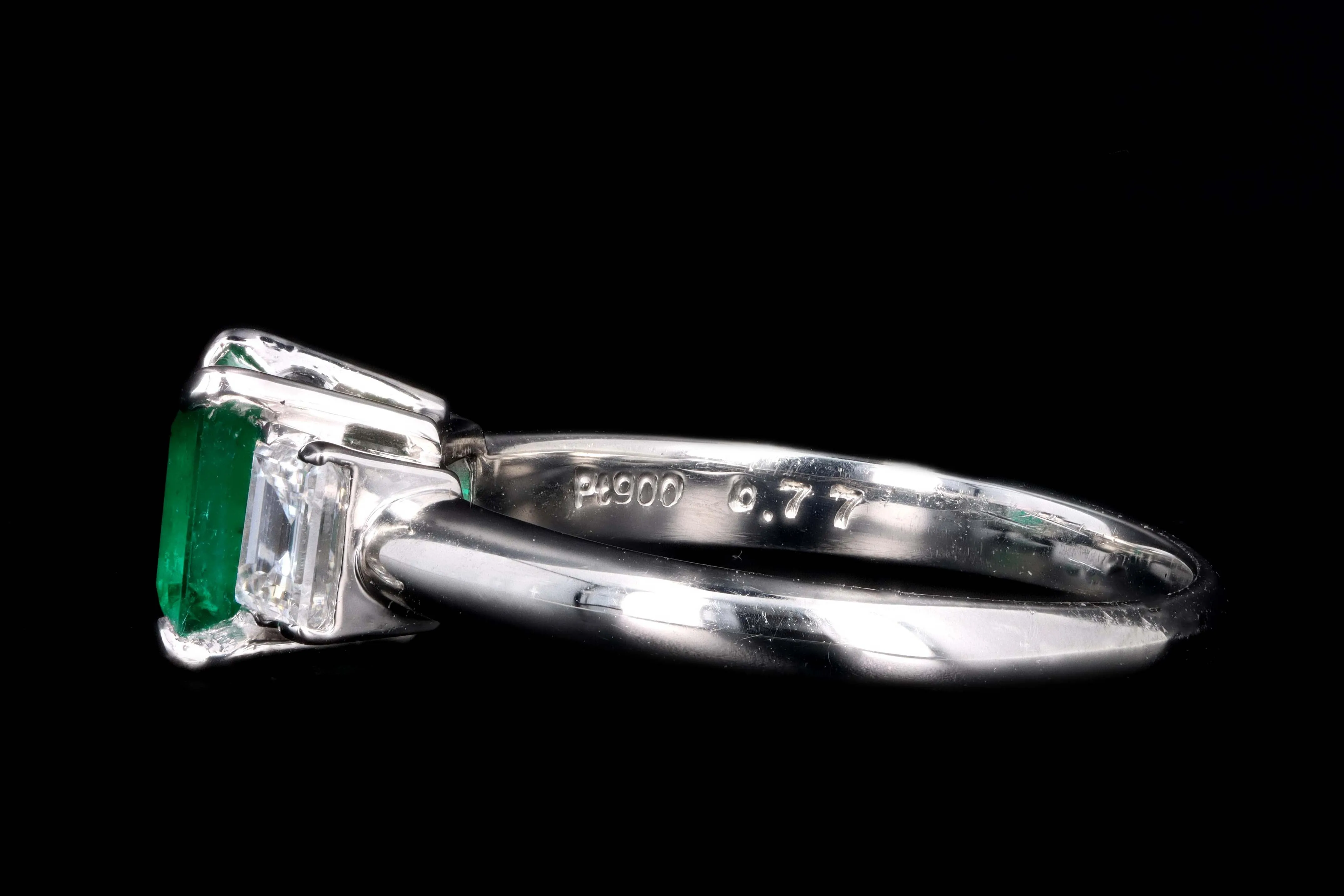 Modern Platinum .77 Carat Emerald & Diamond Ring