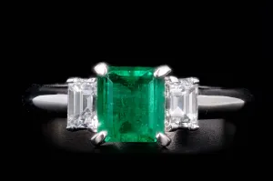 Modern Platinum .77 Carat Emerald & Diamond Ring