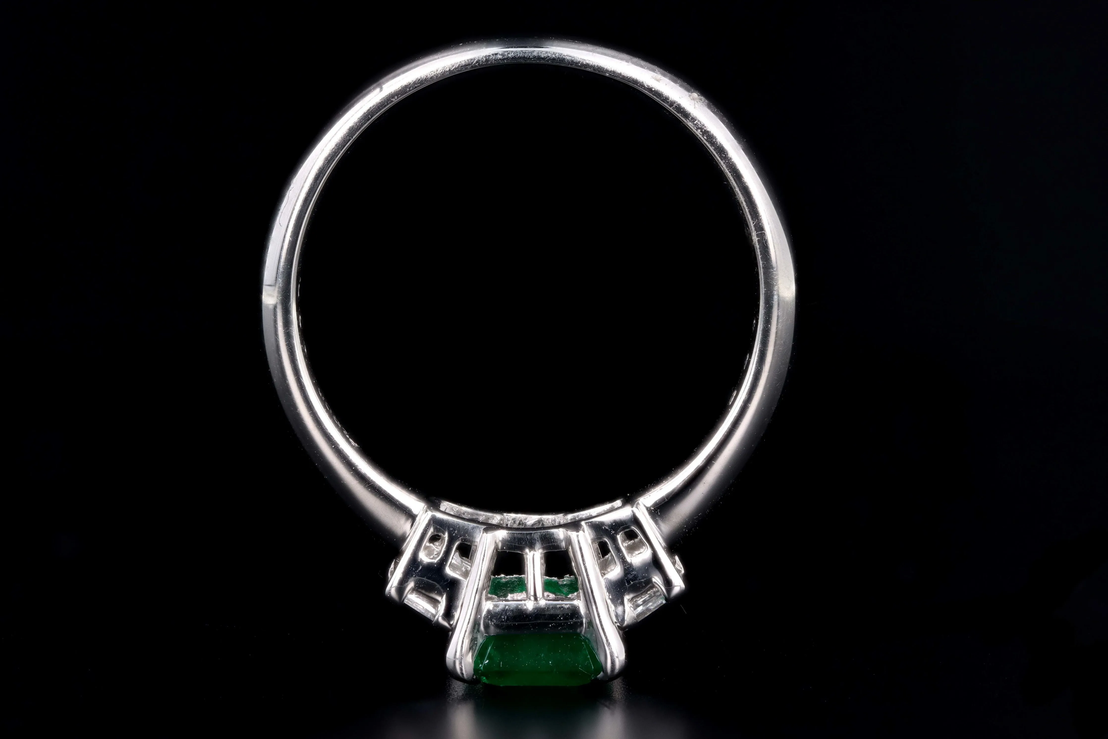 Modern Platinum .77 Carat Emerald & Diamond Ring