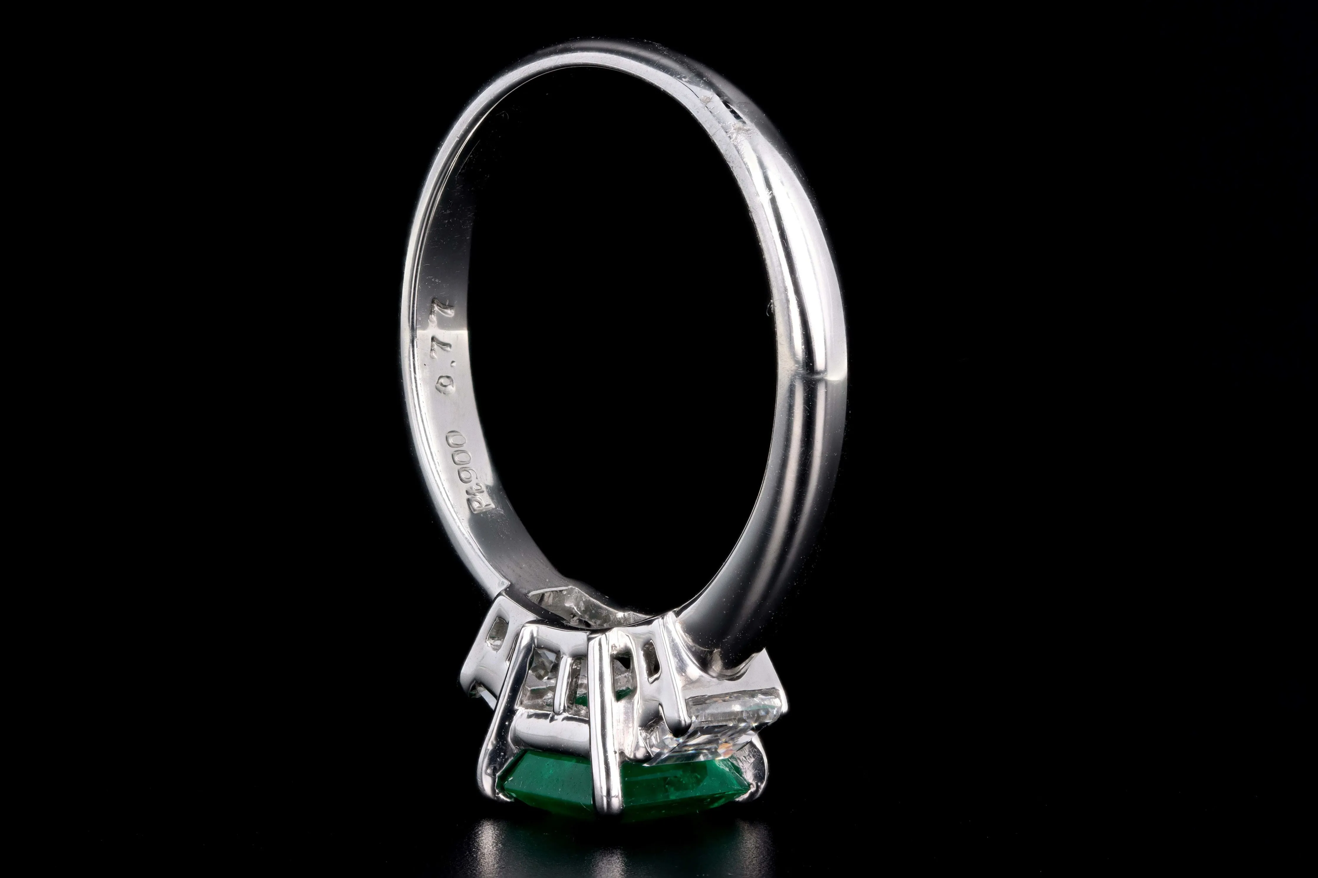 Modern Platinum .77 Carat Emerald & Diamond Ring
