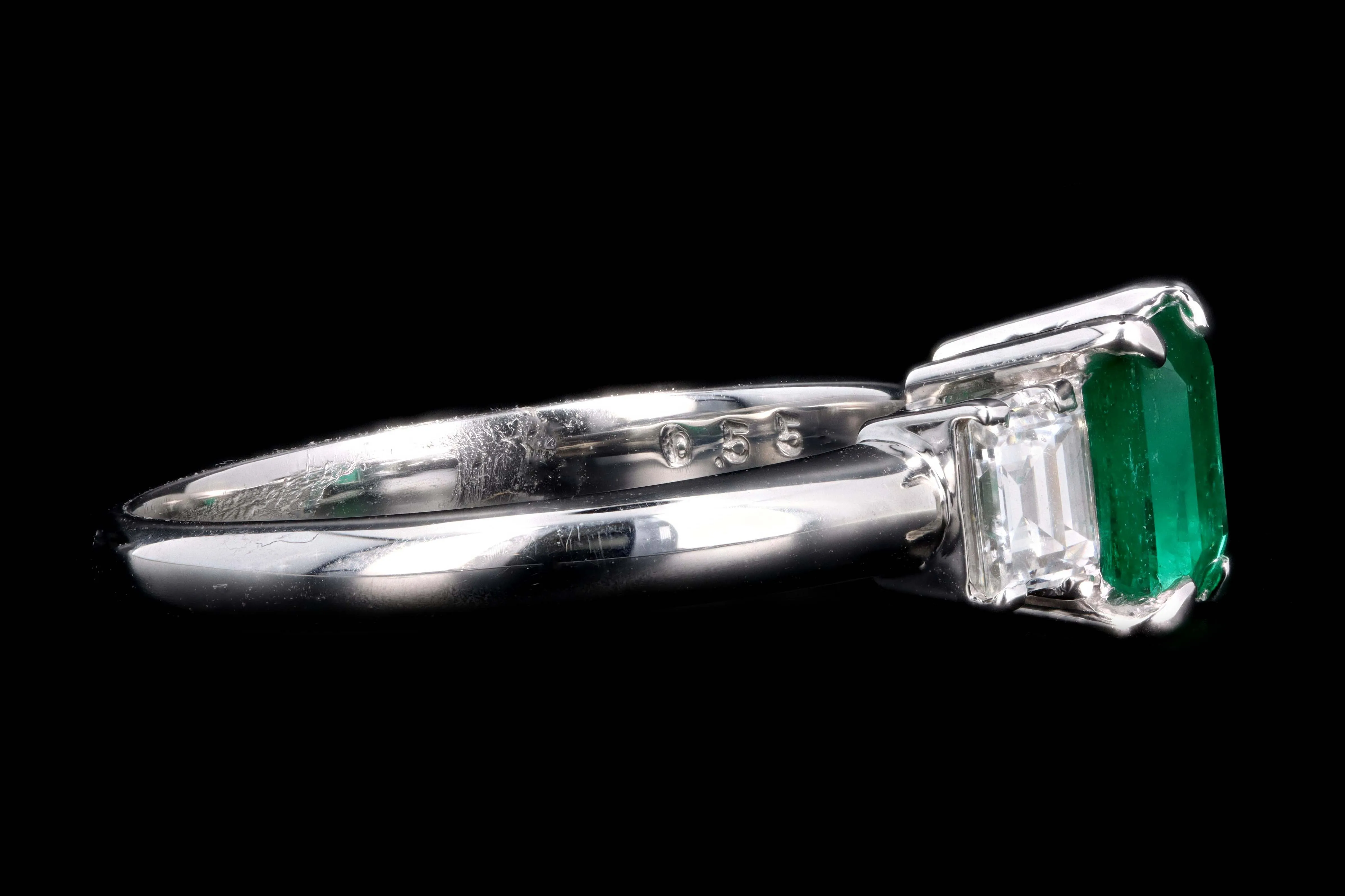 Modern Platinum .77 Carat Emerald & Diamond Ring