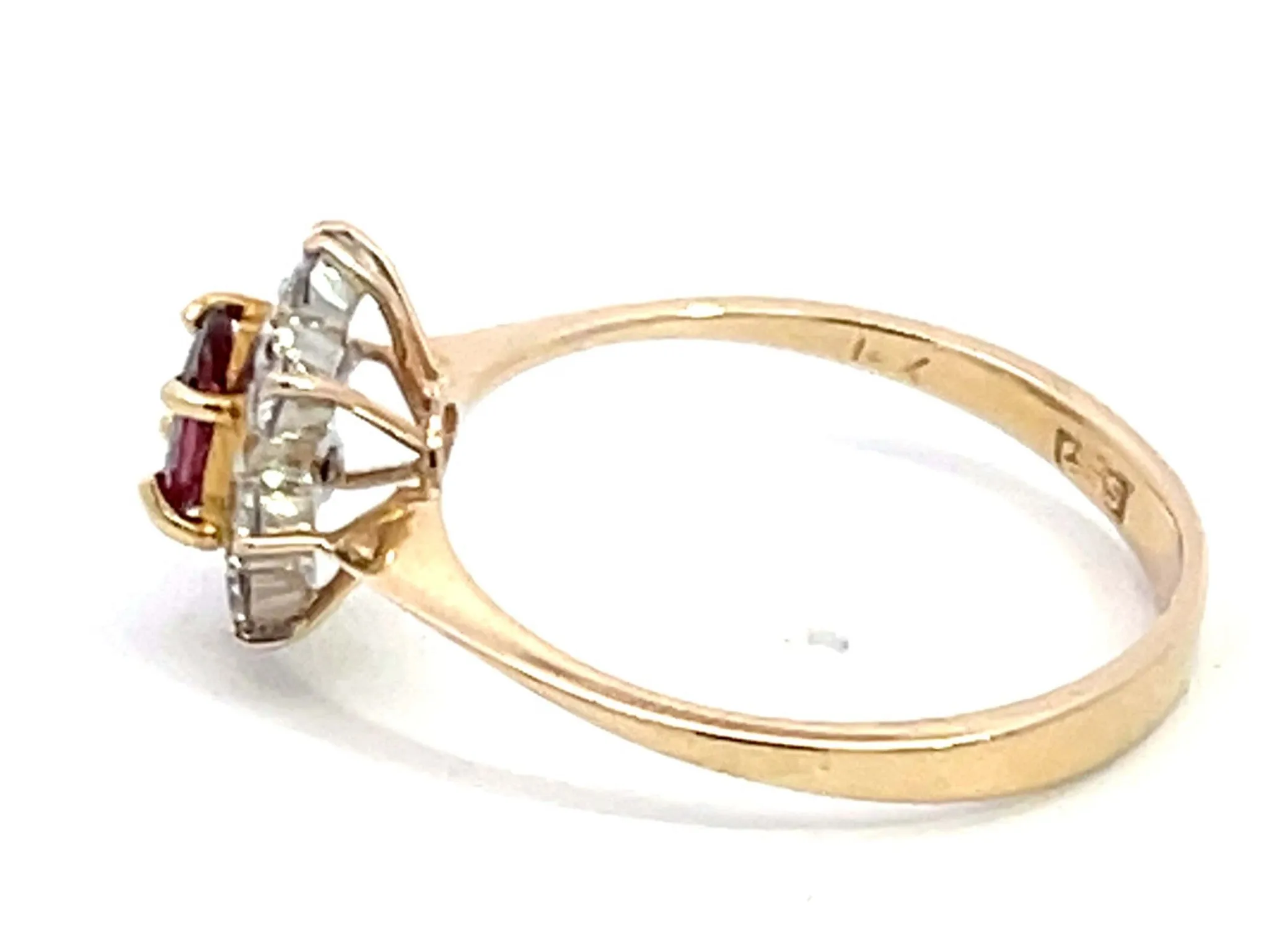 Oval Ruby and Diamond Halo Ring in 14k Yellow Gold