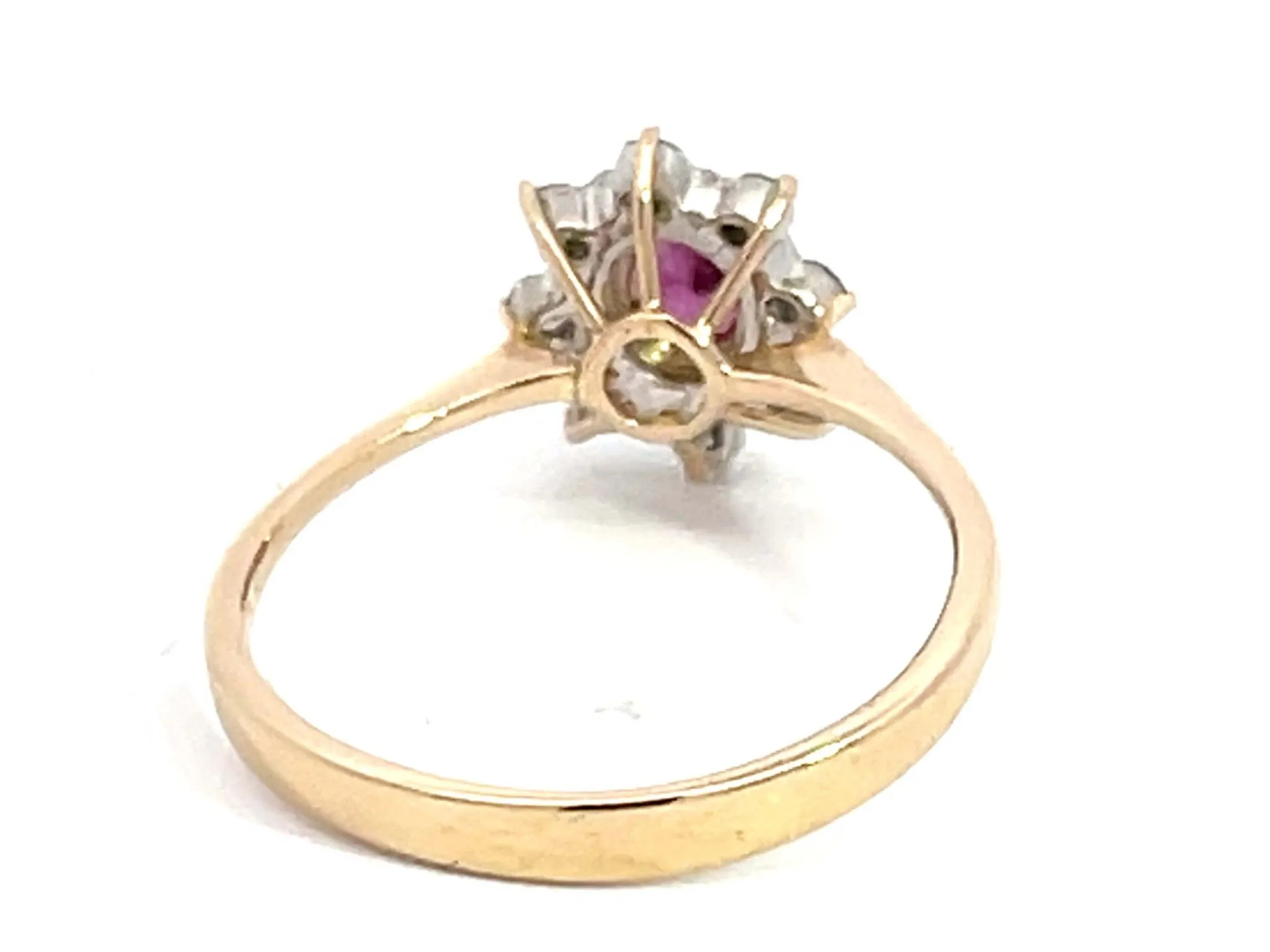Oval Ruby and Diamond Halo Ring in 14k Yellow Gold