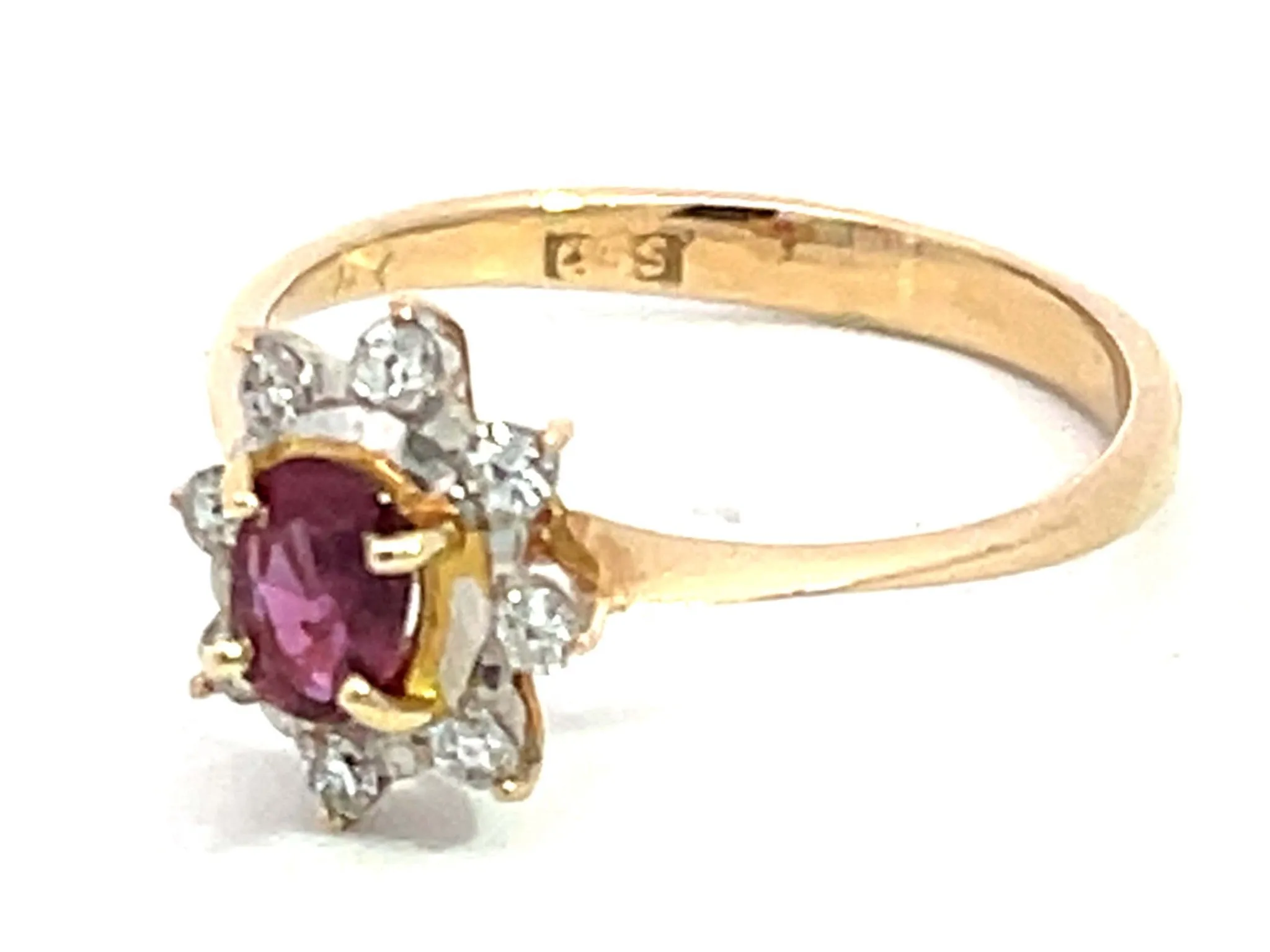 Oval Ruby and Diamond Halo Ring in 14k Yellow Gold