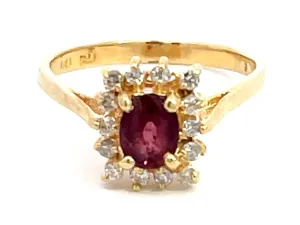Ruby and Diamond Halo Ring in 14k Yellow Gold